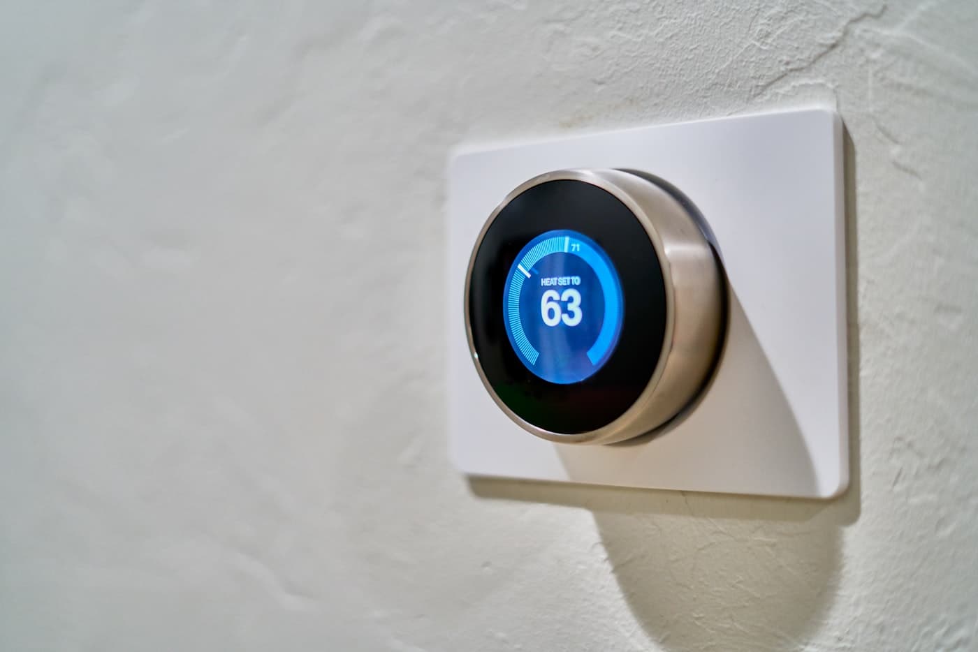 Smart thermostat mounted on a wall